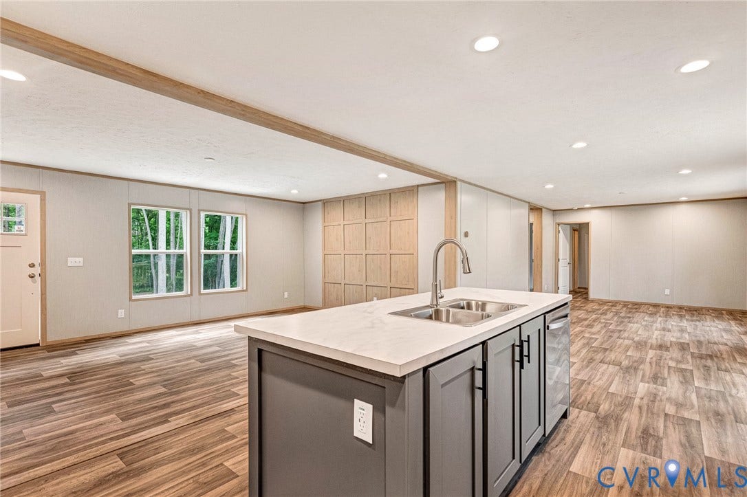 15263 Cross County Road, Mineral, VA 23117 Kitchen island with a light-toned countertop, dual stainless steel sink, and gray cabinetry