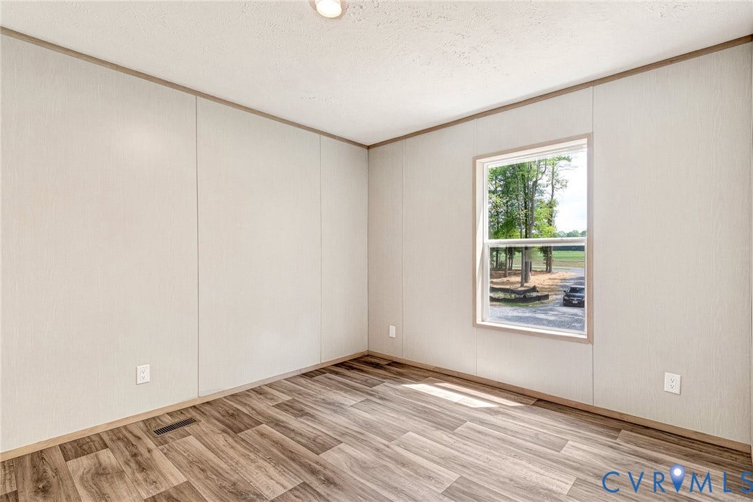15263 Cross County Road, Mineral, VA 23117 Wood-finish flooring, single window, overhead lighting, neutral wall panels, and trim molding