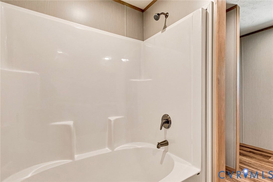 15263 Cross County Road, Mineral, VA 23117 White tub and shower combination with integrated shelving
