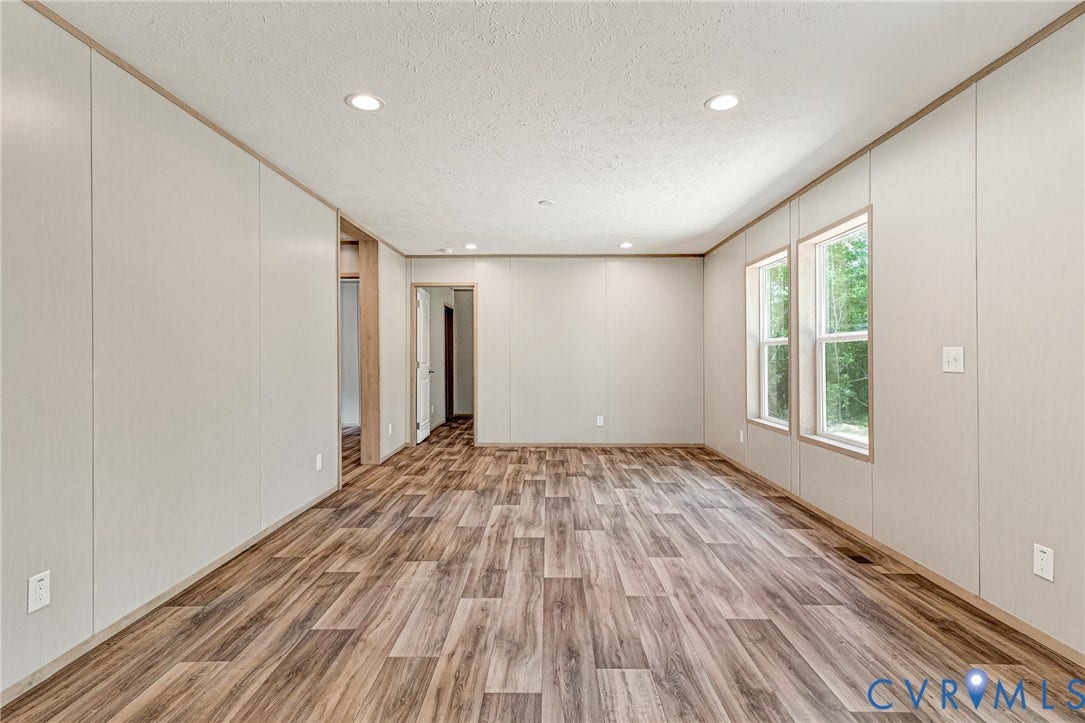 15263 Cross County Road, Mineral, VA 23117 Spacious interior with wood-finish flooring, recessed lighting, and multiple windows