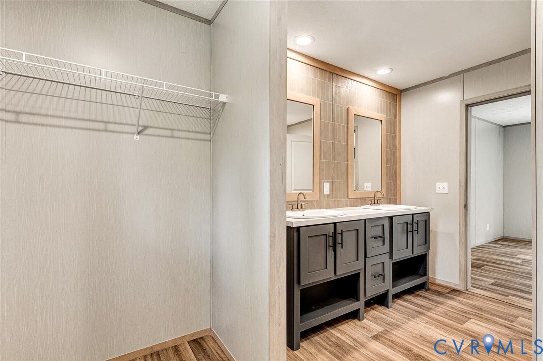 15263 Cross County Road, Mineral, VA 23117 Dual vanity with gray cabinetry, integrated sinks, wood-finish flooring, and recessed lighting