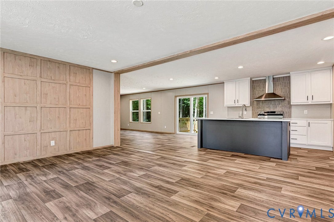 15263 Cross County Road, Mineral, VA 23117 Wood-finish flooring throughout, with a paneled accent wall