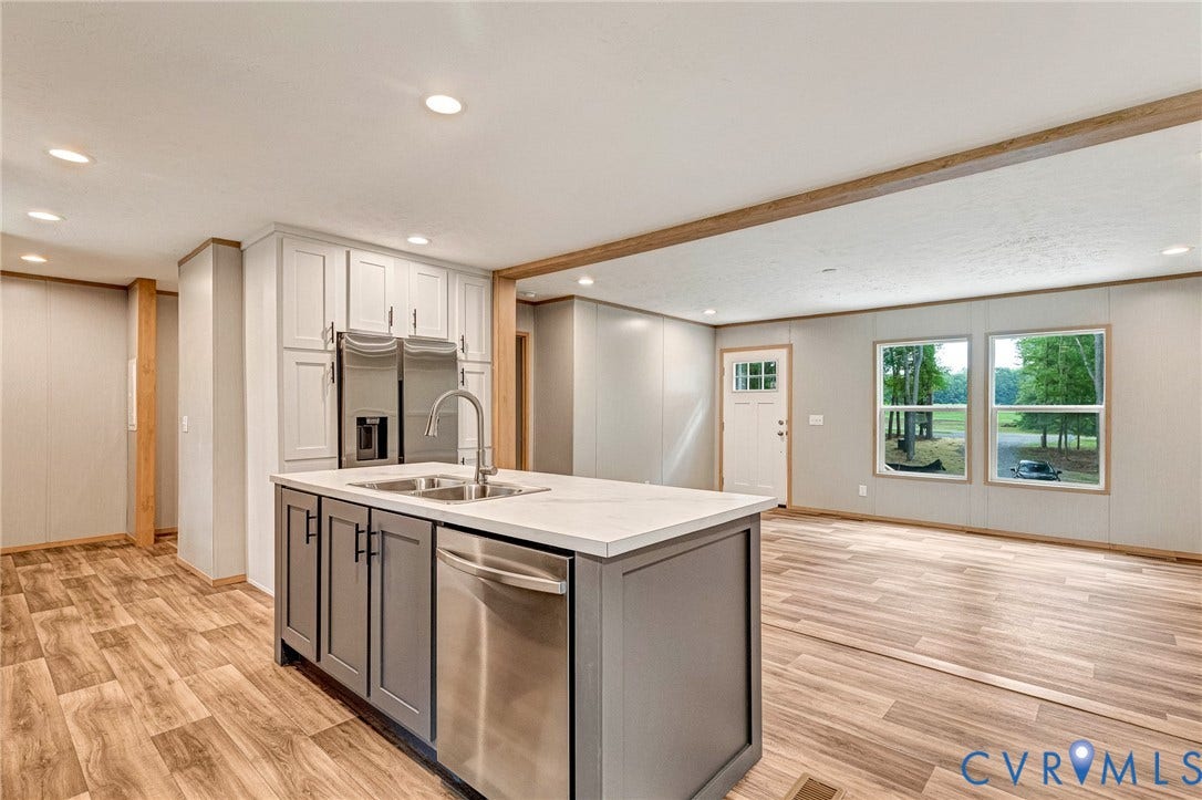 15263 Cross County Road, Mineral, VA 23117 Kitchen island featuring a double-basin stainless steel sink and integrated dishwasher