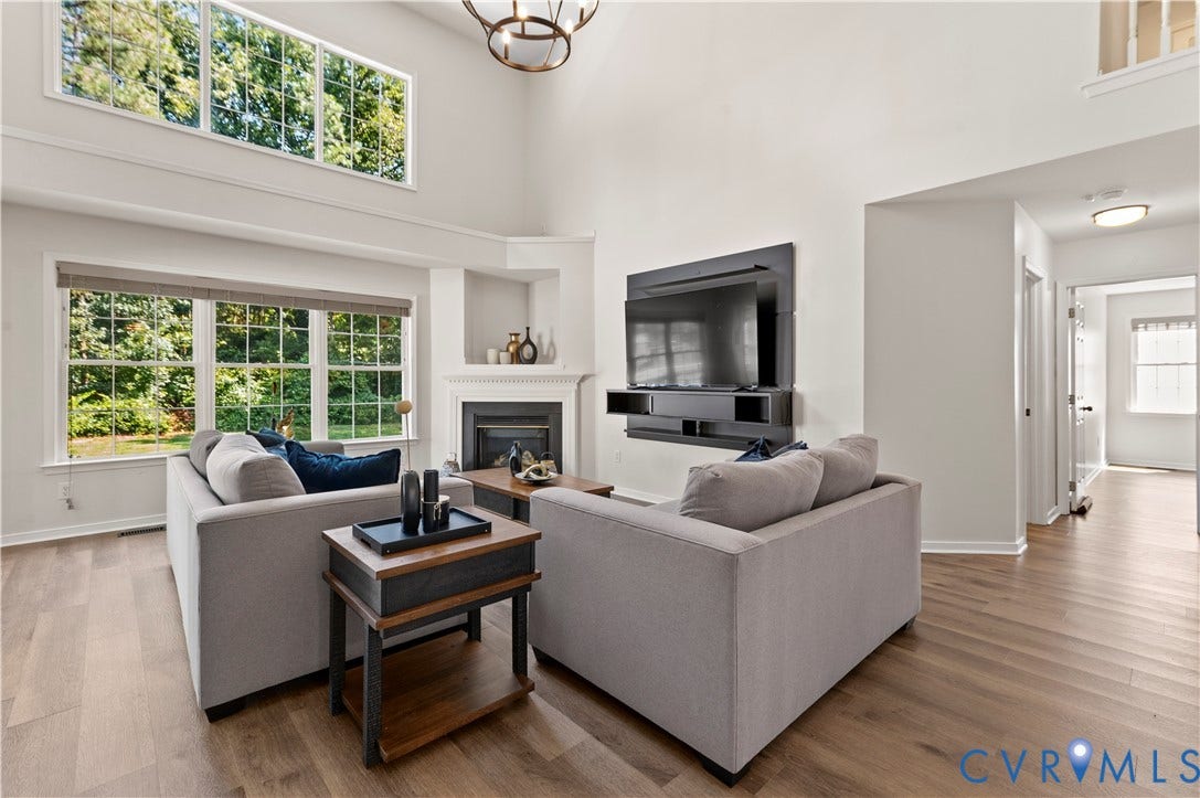 Family room with new flooring and fresh paint.