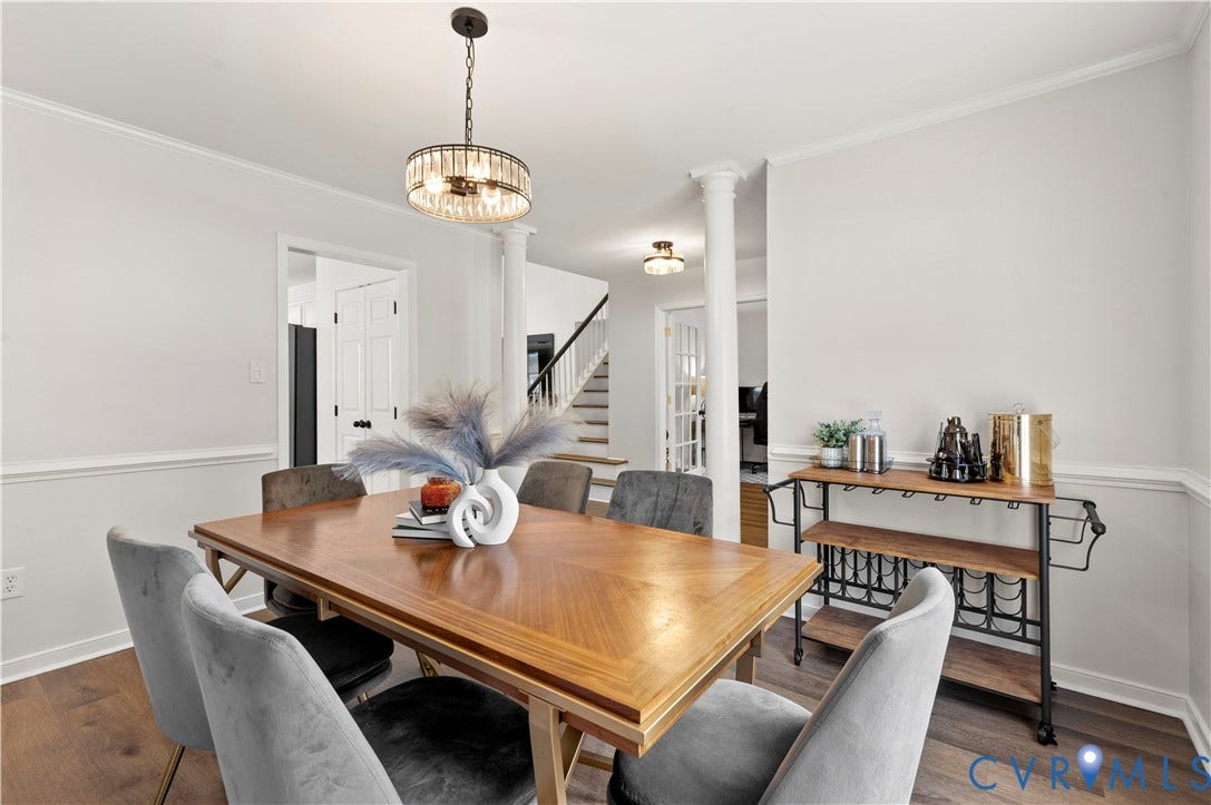 Formal dining room off the foyer with access to the kitchen.