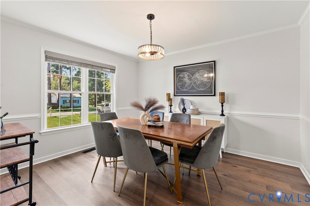 Just off the foyer, dining room has new flooring, paint and fixtures.