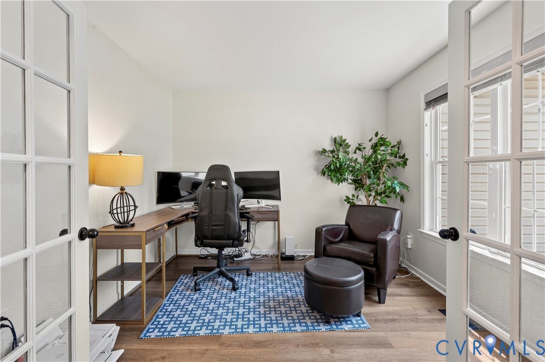 Private office when you first enter with French doors, loads of light, new floors and fresh paint.