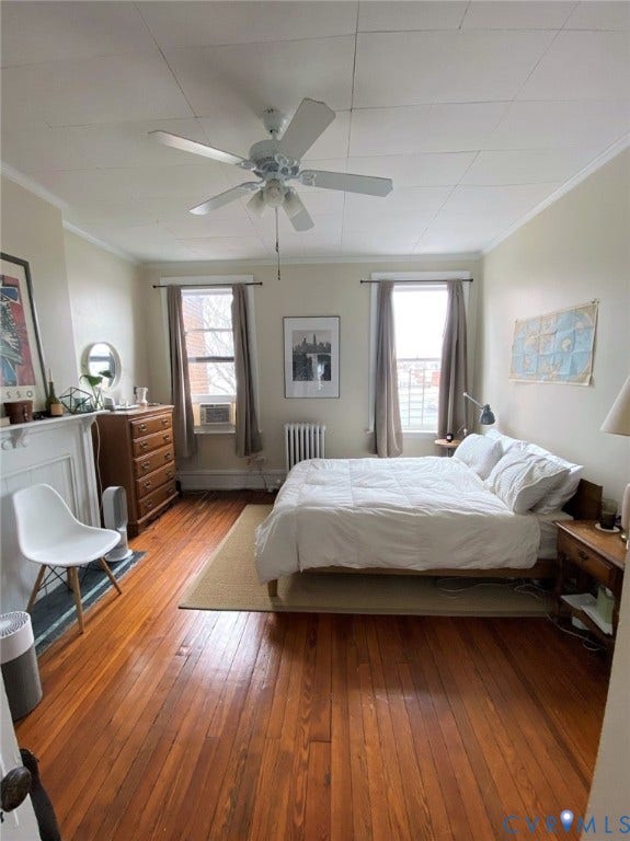 1524 Grove Avenue, Richmond, VA 23220 Hardwood flooring, two windows with blinds, a ceiling fan with integrated lighting, and a decorative fireplace