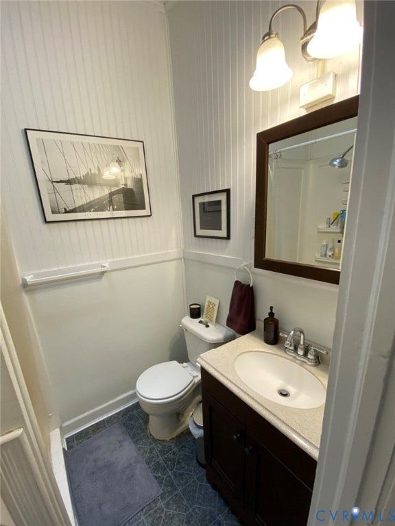 1524 Grove Avenue, Richmond, VA 23220 Vanity with a light-colored countertop, white oval sink, and chrome faucet