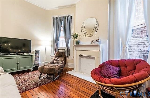 1524 Grove Avenue, Richmond, VA 23220 Hardwood flooring throughout, featuring a decorative fireplace with a mantel, and crown molding