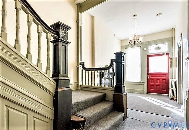 1524 Grove Avenue, Richmond, VA 23220 Staircase with wood newel posts, turned wood balusters, and carpeted treads