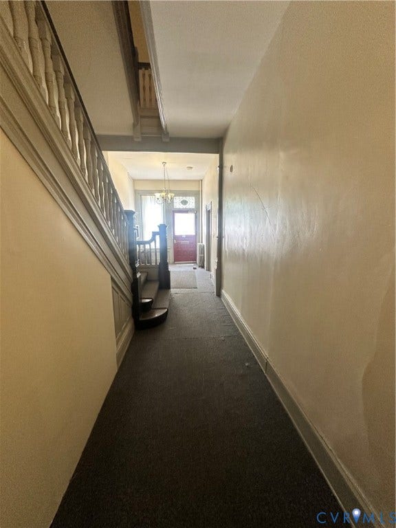 1524 Grove Avenue, Richmond, VA 23220 Extended hallway with carpet flooring and ornate wooden staircase