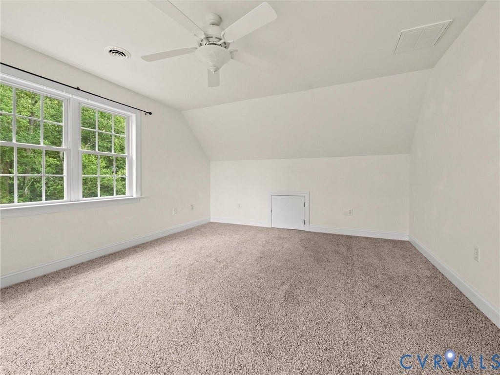 6126 Cartersville Road, Powhatan, VA 23139 Carpeted room featuring a ceiling fan, a window with muntins, and a sloped ceiling