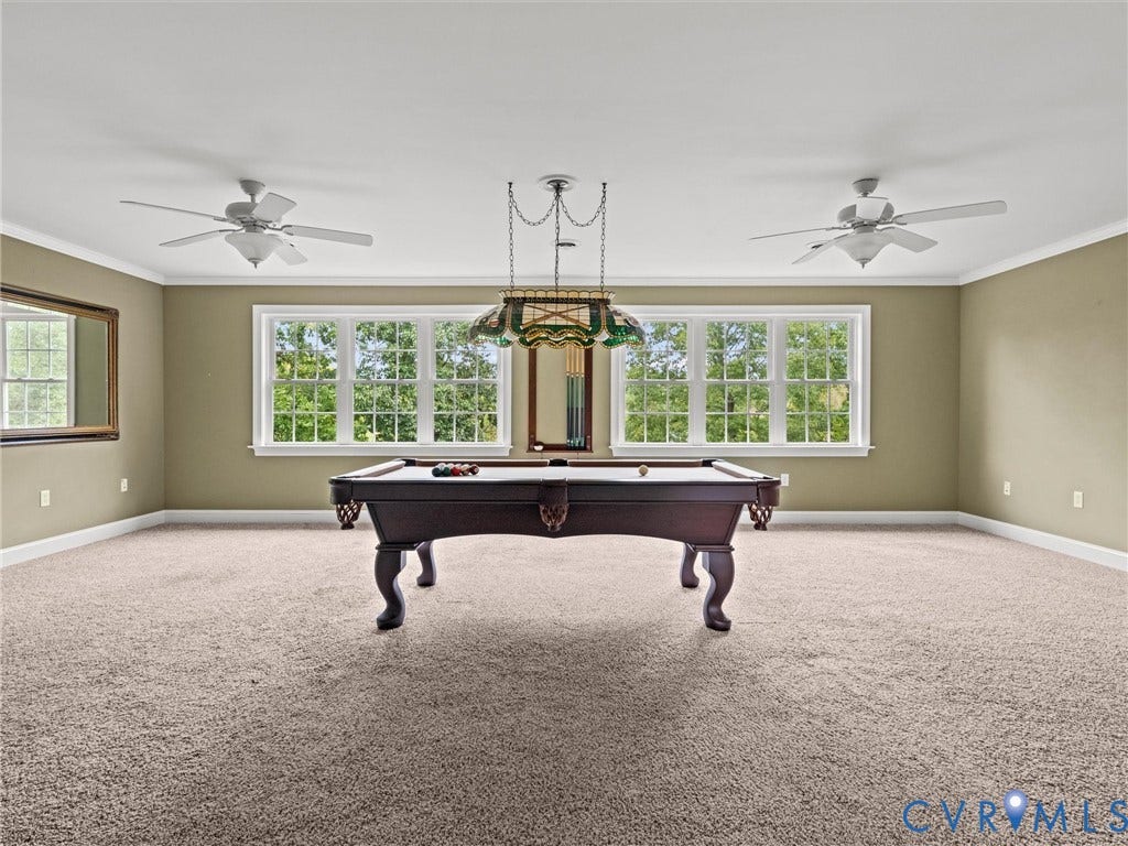6126 Cartersville Road, Powhatan, VA 23139 Expansive room featuring carpet flooring, two ceiling fans, and multiple double-hung windows