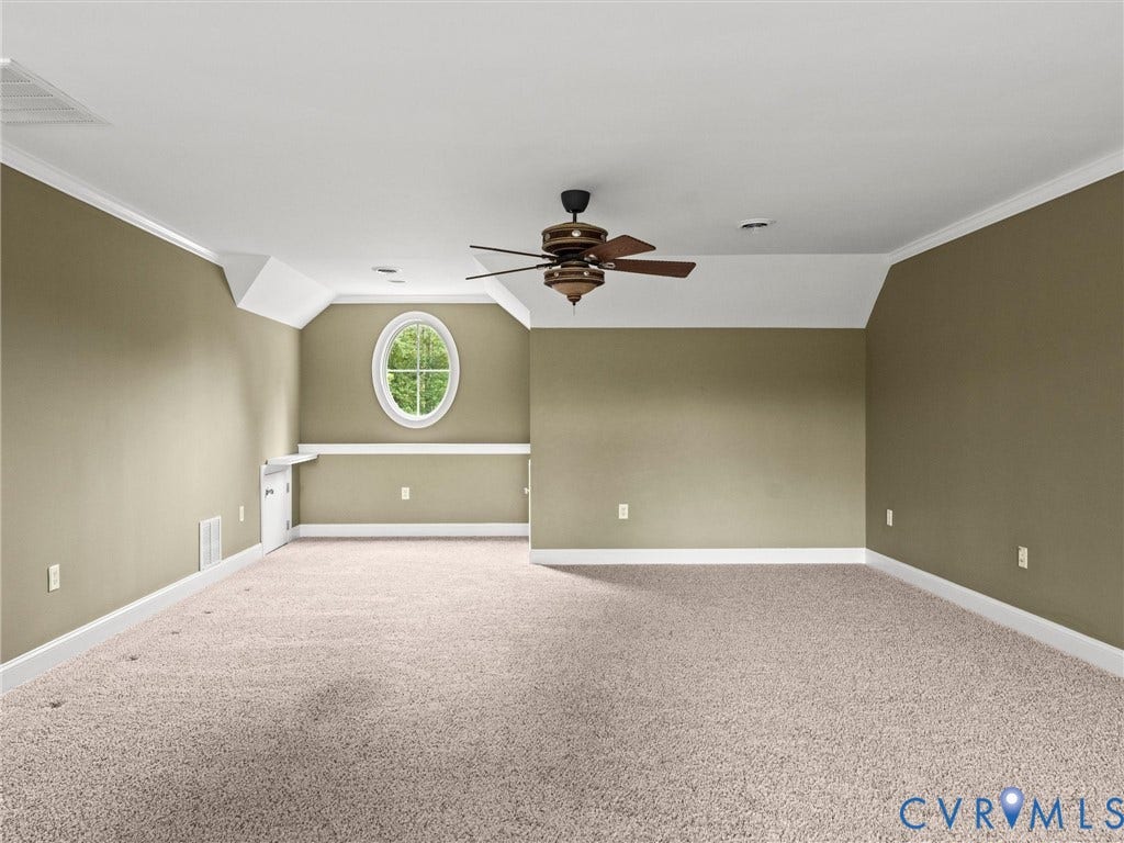 6126 Cartersville Road, Powhatan, VA 23139 Spacious room featuring neutral carpeting, an oval window, and a ceiling fan