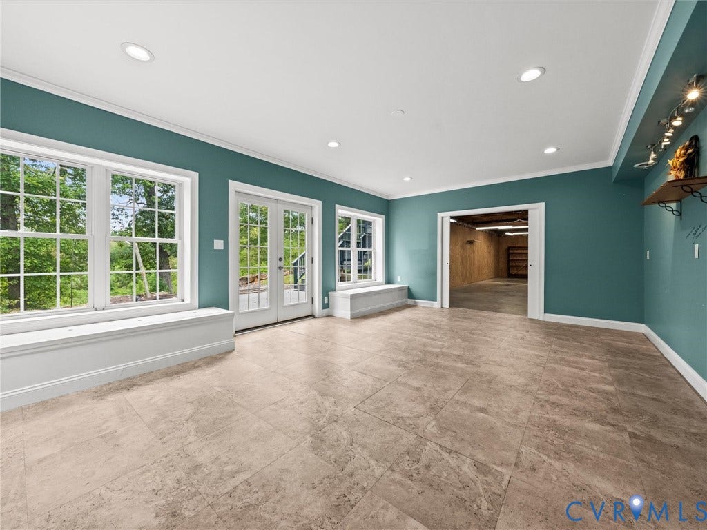 6126 Cartersville Road, Powhatan, VA 23139 Spacious room featuring large windows, double French doors, recessed lighting, and tile flooring