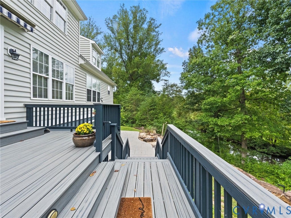 6126 Cartersville Road, Powhatan, VA 23139 Expansive multi-level deck with integrated lighting, durable composite decking, and a privacy railing