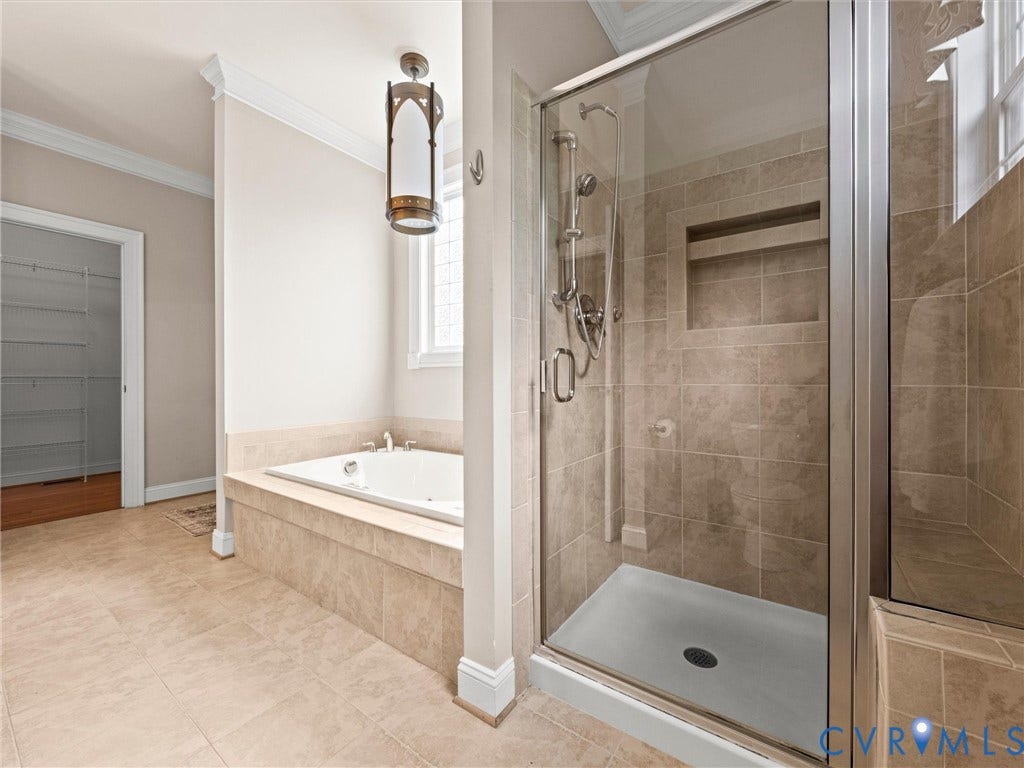 6126 Cartersville Road, Powhatan, VA 23139 Built-in jetted tub, glass-enclosed shower with tile surround, recessed shower niche, and tile flooring