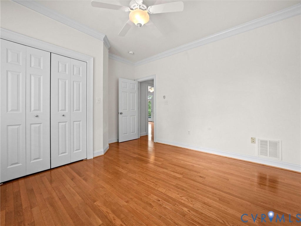 6126 Cartersville Road, Powhatan, VA 23139 Wood-finish flooring, crown molding, and a ceiling fan