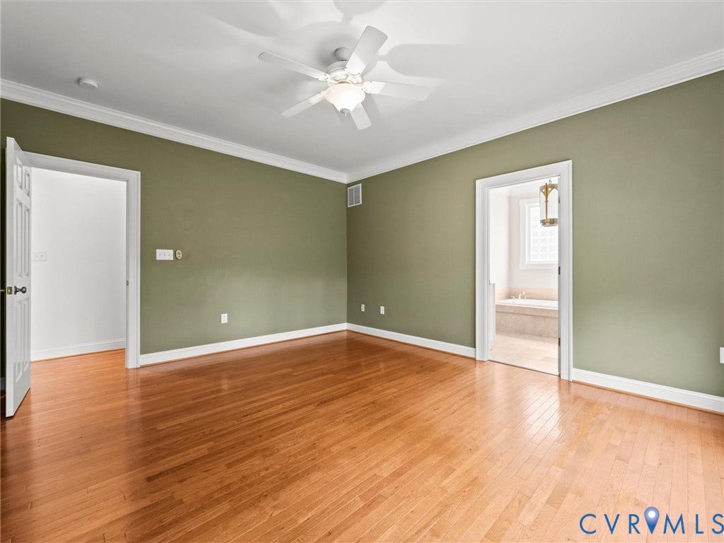 6126 Cartersville Road, Powhatan, VA 23139 Hardwood flooring throughout, ceiling fan, crown molding, and direct access to an ensuite bathroom with a built-in tub