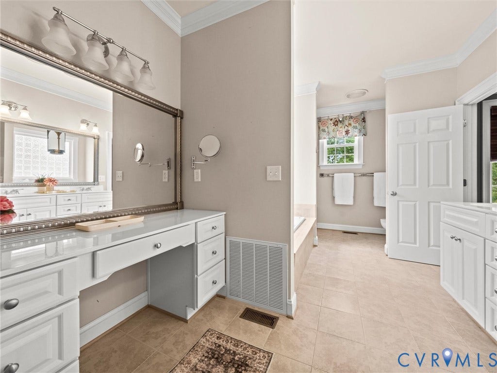6126 Cartersville Road, Powhatan, VA 23139 Spacious bathroom featuring a built-in vanity with drawers, a large wall-mounted mirror, and tile flooring