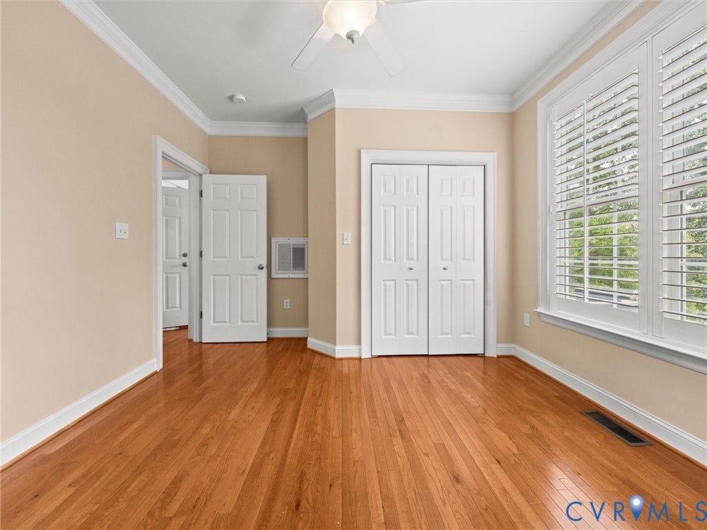 6126 Cartersville Road, Powhatan, VA 23139 Hardwood flooring, crown molding, white plantation shutters, bi-fold closet doors, and a ceiling fan