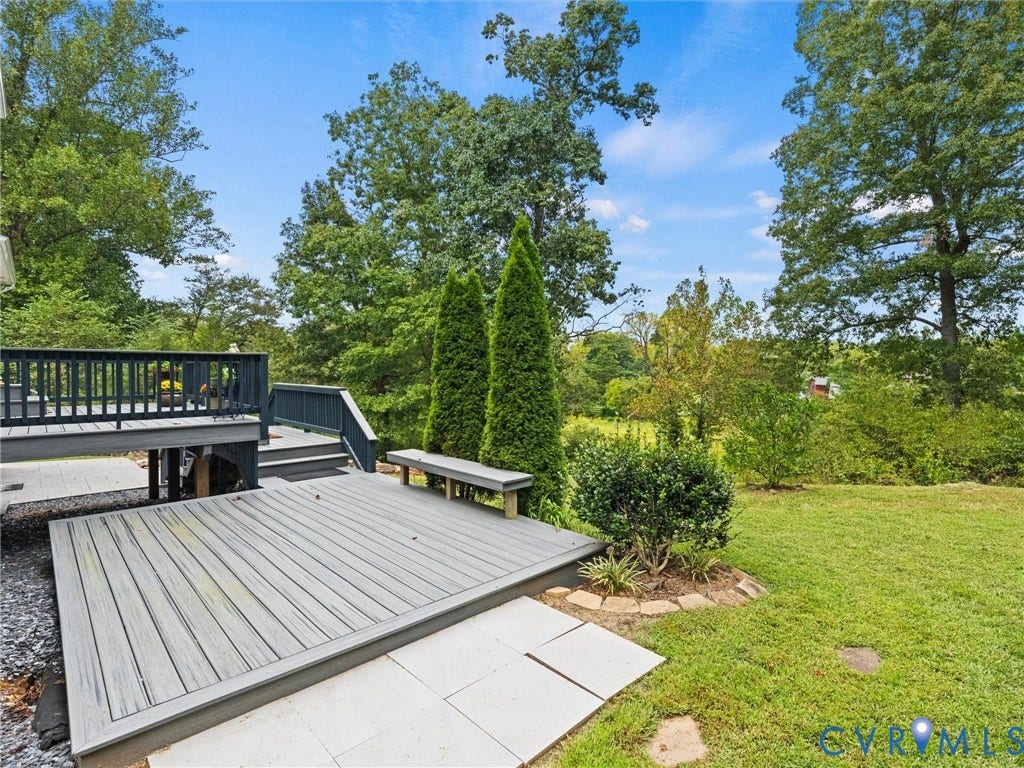 6126 Cartersville Road, Powhatan, VA 23139 Multi-level composite deck with integrated bench seating, established plantings, and a manicured lawn