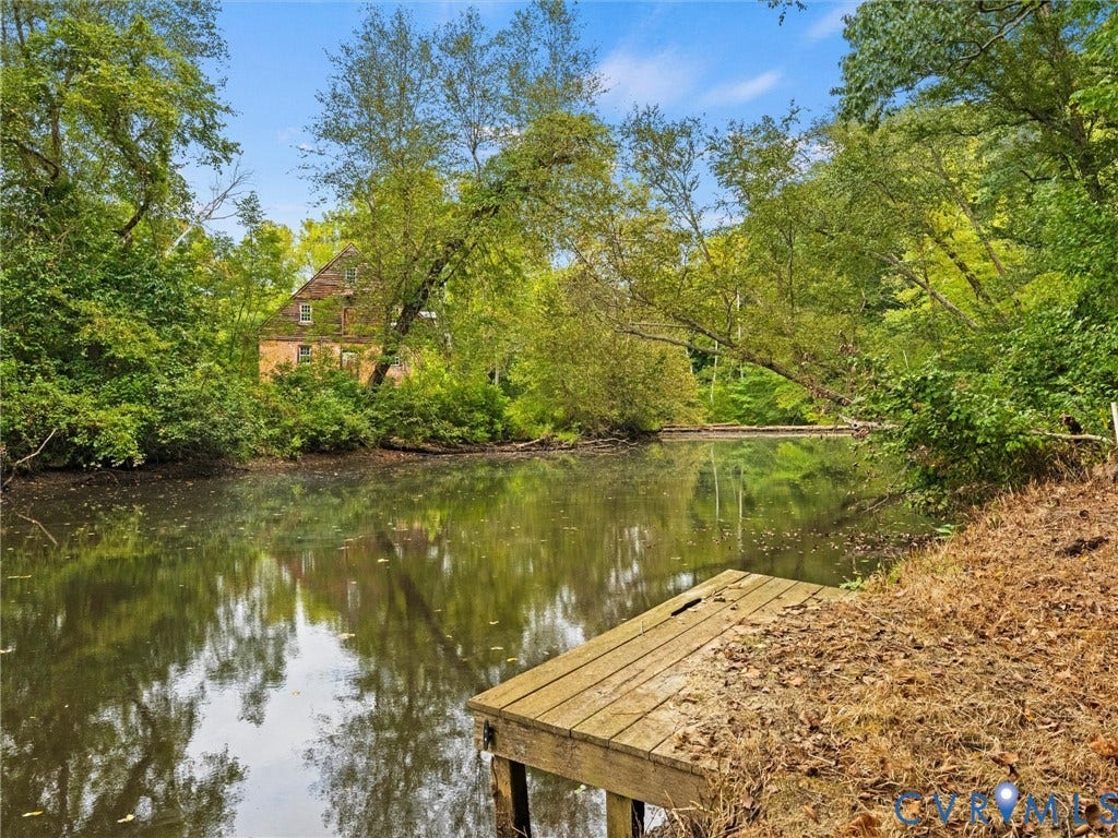 6126 Cartersville Road, Powhatan, VA 23139 Waterfront property featuring a wooded shoreline and a wooden dock