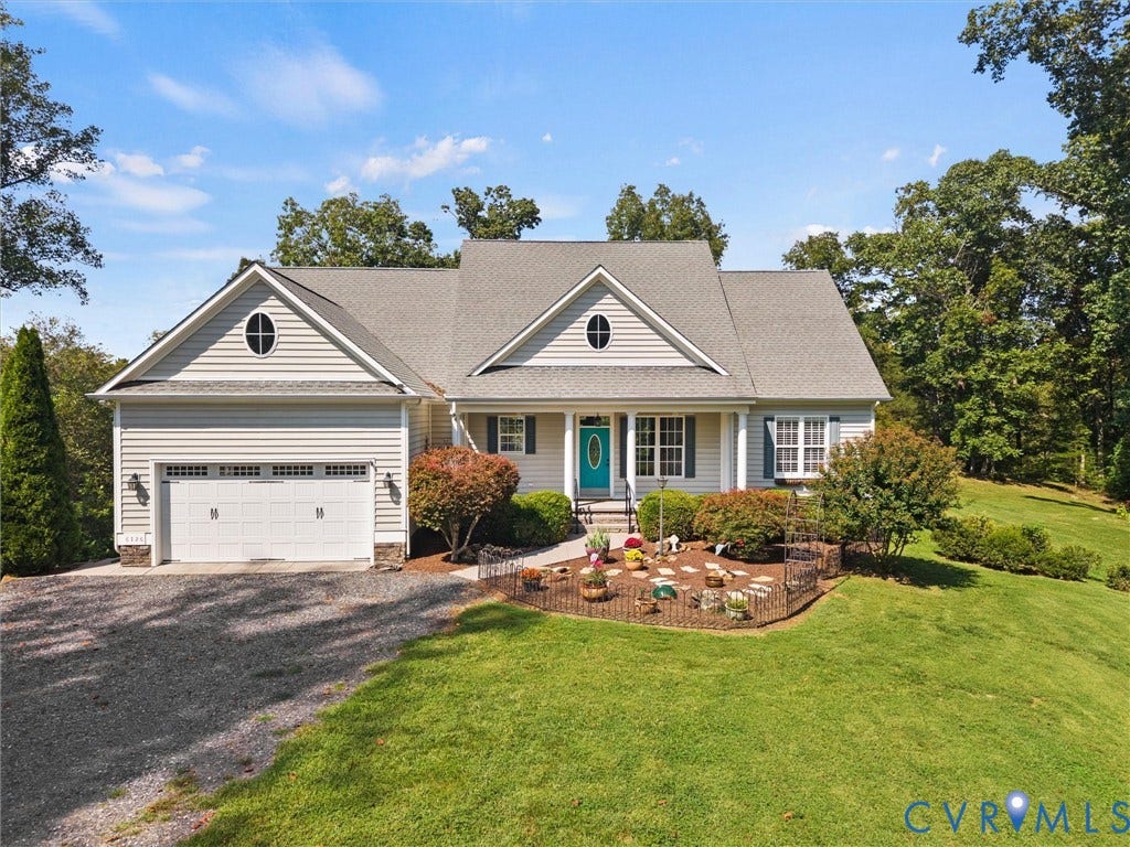 6126 Cartersville Road, Powhatan, VA 23139 Ranch-style exterior with light-colored siding, a two-car garage, and a gravel driveway