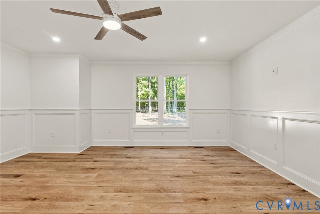 6465 Anderson Highway, Powhatan, VA 23139 Wood-finish flooring, wainscoting, recessed lighting, and a ceiling fan with integrated light