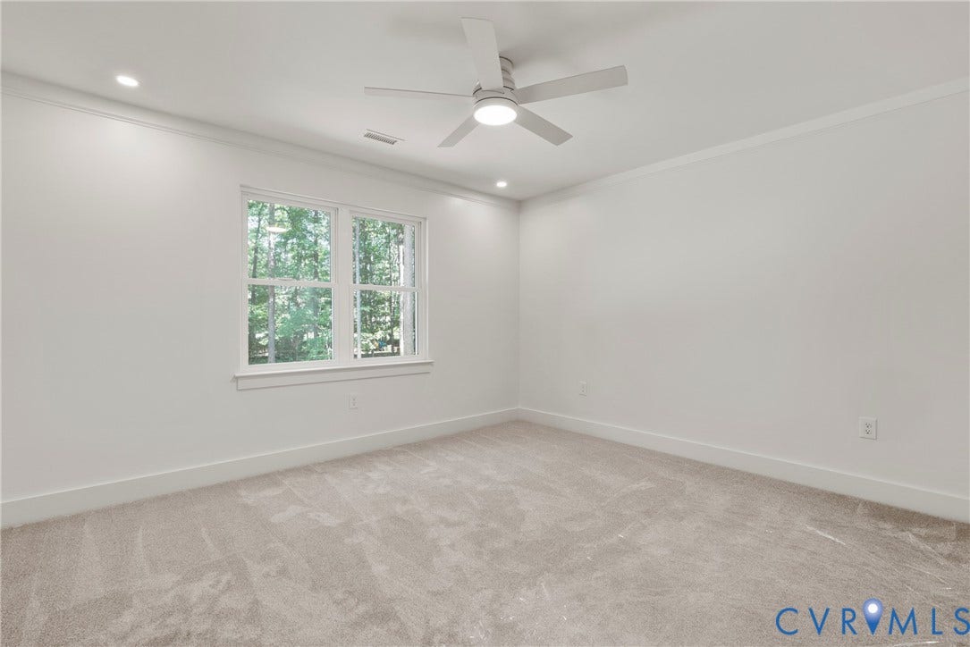6465 Anderson Highway, Powhatan, VA 23139 White walls, light neutral carpet, ceiling fan, recessed lighting, and crown molding