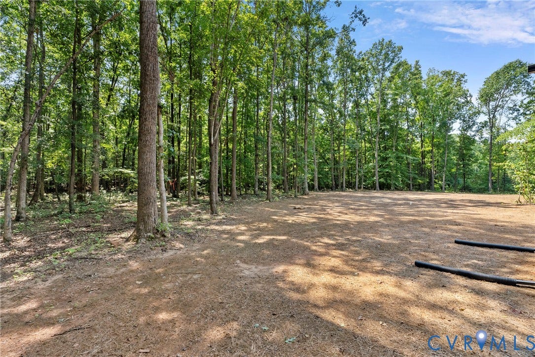 6465 Anderson Highway, Powhatan, VA 23139 Expansive cleared land area surrounded by mature trees