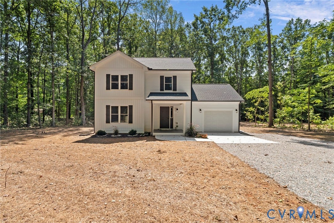 6465 Anderson Highway, Powhatan, VA 23139 Two-story home with white siding, dark shutters, and a single-car garage