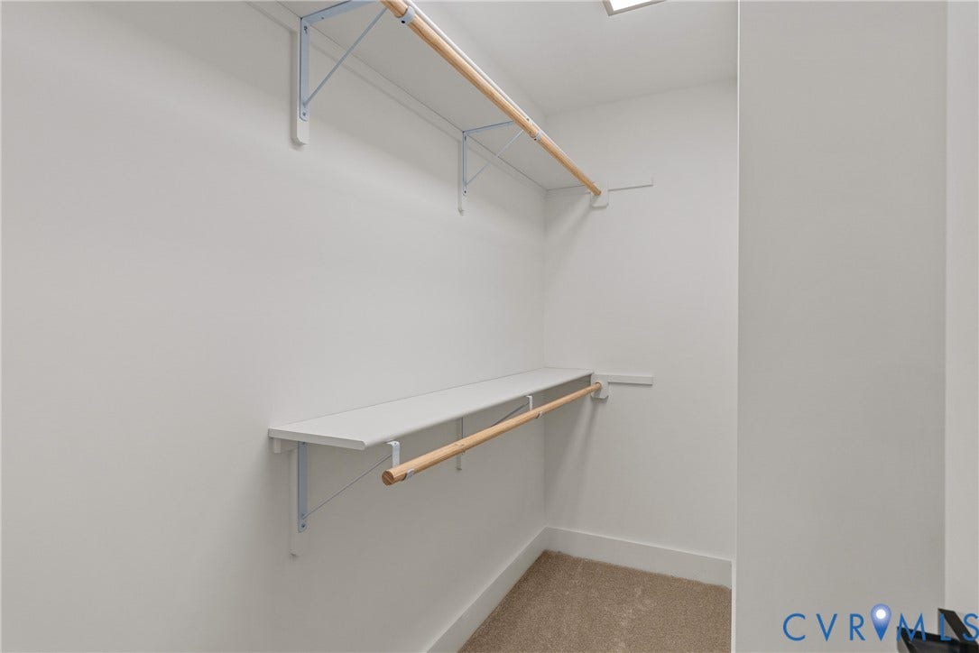 6465 Anderson Highway, Powhatan, VA 23139 Built-in shelving with hanging rods and carpet flooring
