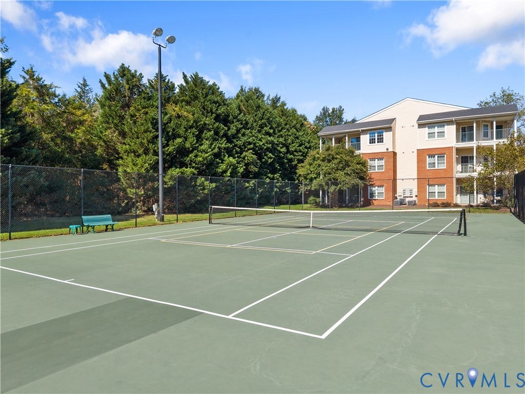 821 Brassie Lane, #E, The Crossings Golf Course Area, Glen Allen, VA 23059 Hard-surfaced tennis court featuring perimeter fencing and overhead area lighting