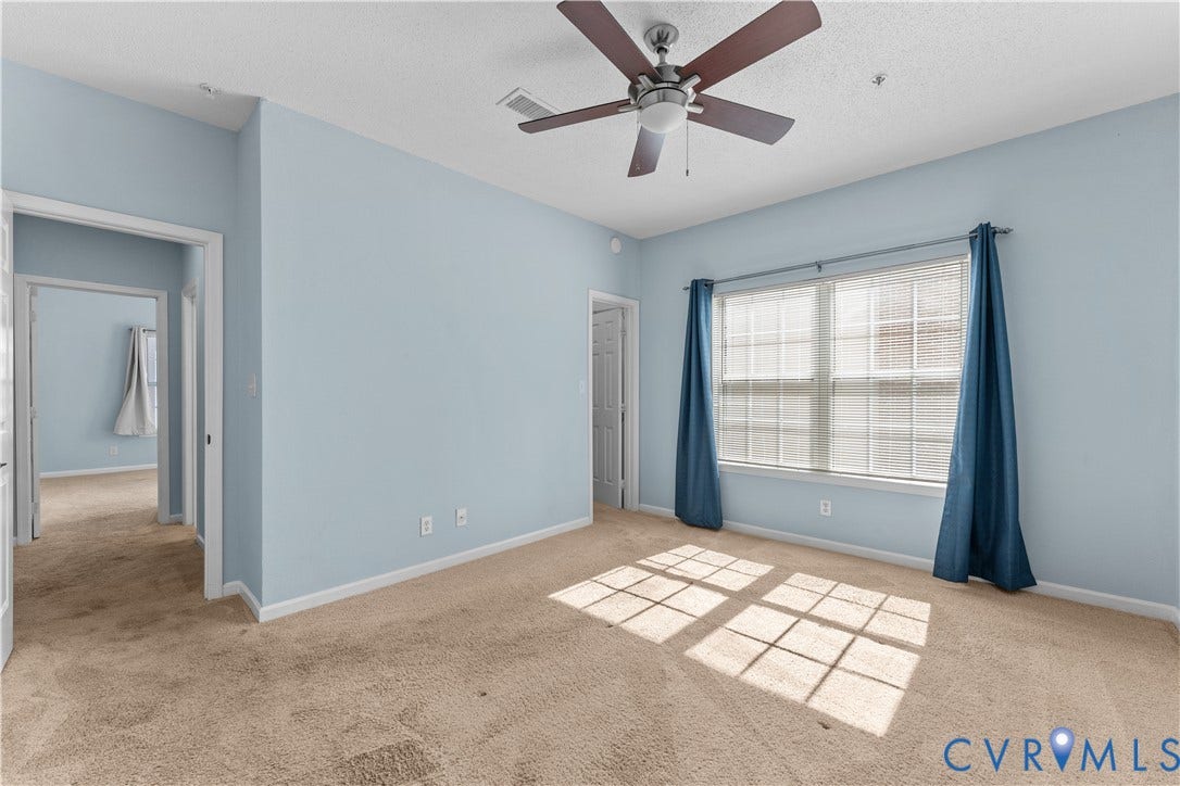 821 Brassie Lane, #E, The Crossings Golf Course Area, Glen Allen, VA 23059 Carpeted room featuring a ceiling fan with integrated lighting, dual-pane window, and light-toned wall finish