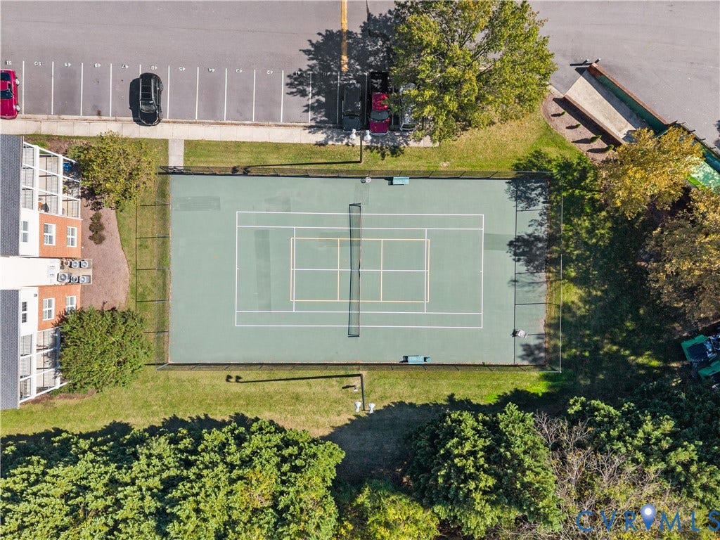 821 Brassie Lane, #E, The Crossings Golf Course Area, Glen Allen, VA 23059 Tennis court featuring a paved surface, perimeter chain-link fencing, net, and ground-mounted lighting