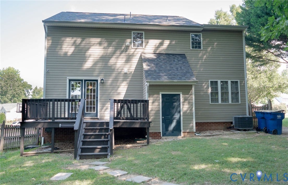 15349 Featherchase Drive, Chesterfield, VA 23832 Rear exterior with a black wood deck, sliding glass doors, and a ground-level door