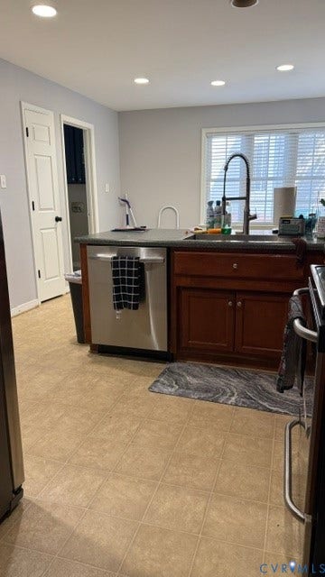 15349 Featherchase Drive, Chesterfield, VA 23832 Kitchen island with dark cabinetry, stainless steel dishwasher, and a contemporary black faucet