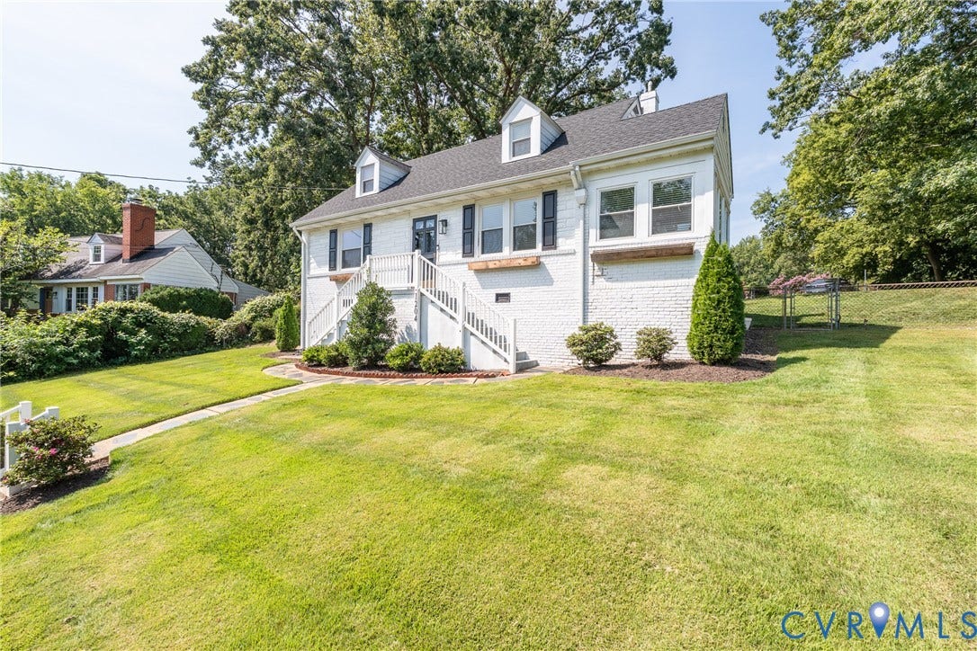 1204 Maywood Road, Beverly Hills, Henrico, VA 23229 White brick exterior with a dark roof and dormer windows