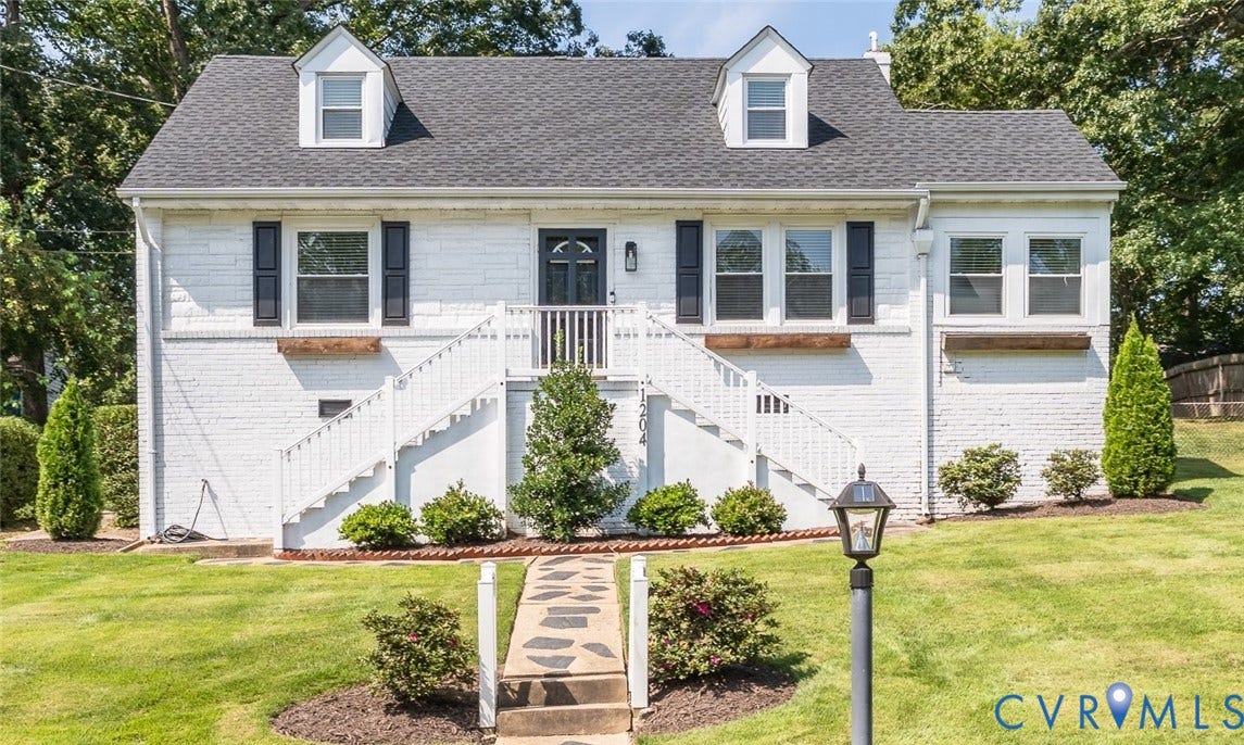 1204 Maywood Road, Beverly Hills, Henrico, VA 23229 White brick exterior with a dark shingle roof and dormer windows
