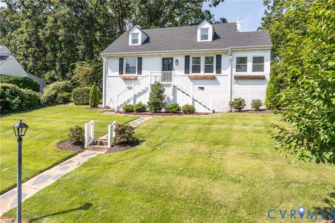 1204 Maywood Road, Beverly Hills, Henrico, VA 23229 White brick exterior with black shutters, dormer windows, and a gabled roof