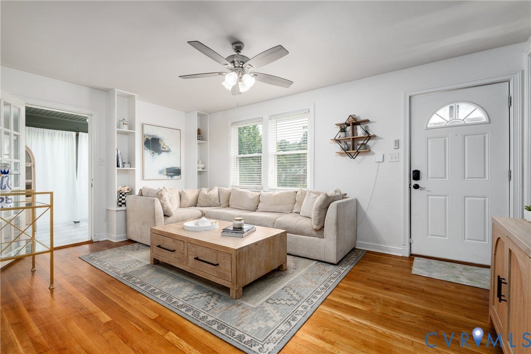 1204 Maywood Road, Beverly Hills, Henrico, VA 23229 Hardwood flooring, ceiling fan with integrated lighting, built-in shelving, windows with blinds, and a paneled entry door with transom