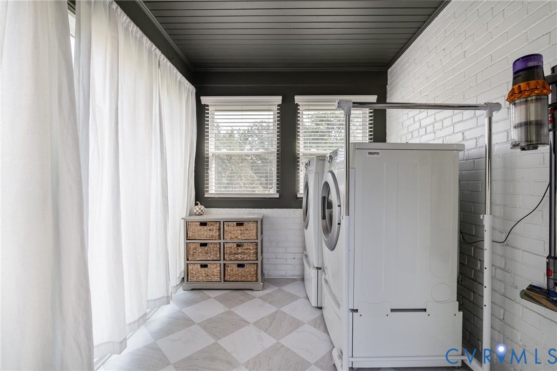 1204 Maywood Road, Beverly Hills, Henrico, VA 23229 White brick accent wall, checkered flooring, dark paneled ceiling, and two windows with blinds