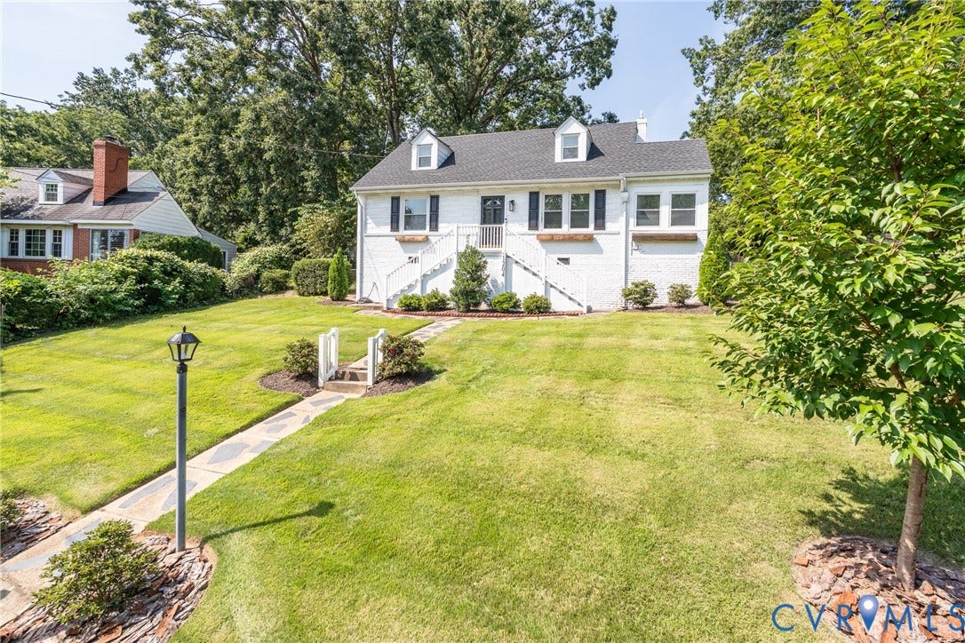 1204 Maywood Road, Beverly Hills, Henrico, VA 23229 White brick exterior with black shutters and a black front door