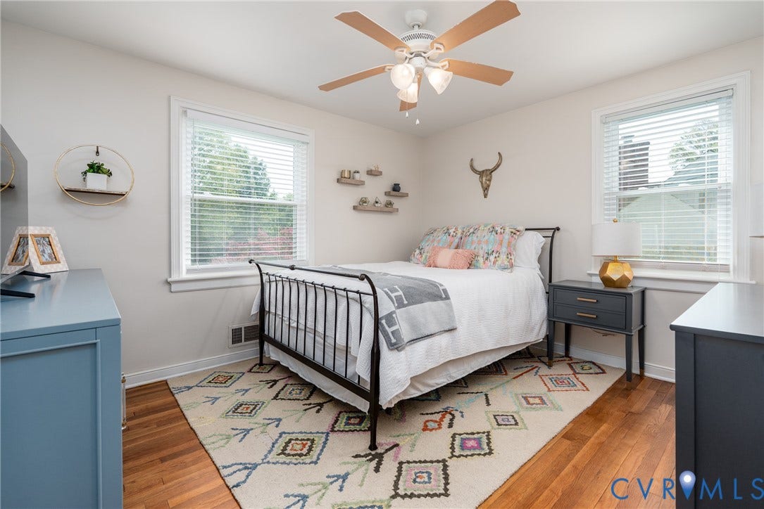 1204 Maywood Road, Beverly Hills, Henrico, VA 23229 Bright bedroom offering hardwood flooring, a ceiling fan with integrated lighting, and ample natural light from multiple windows