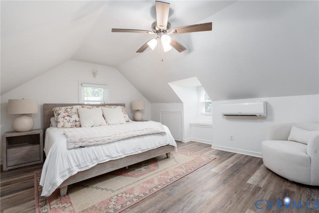 1204 Maywood Road, Beverly Hills, Henrico, VA 23229 Attic room featuring a sloped ceiling, wood-finish flooring, a ceiling fan with integrated lighting, and a wall-mounted air conditioning unit