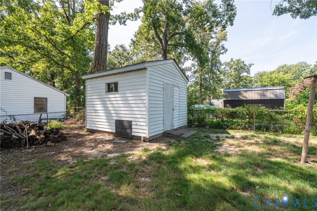1204 Maywood Road, Beverly Hills, Henrico, VA 23229 White vinyl siding shed with an exterior window