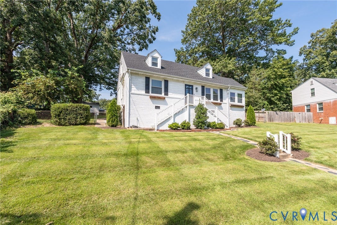 1204 Maywood Road, Beverly Hills, Henrico, VA 23229 White brick exterior featuring dormer windows, a dark shingled roof, and dark window shutters