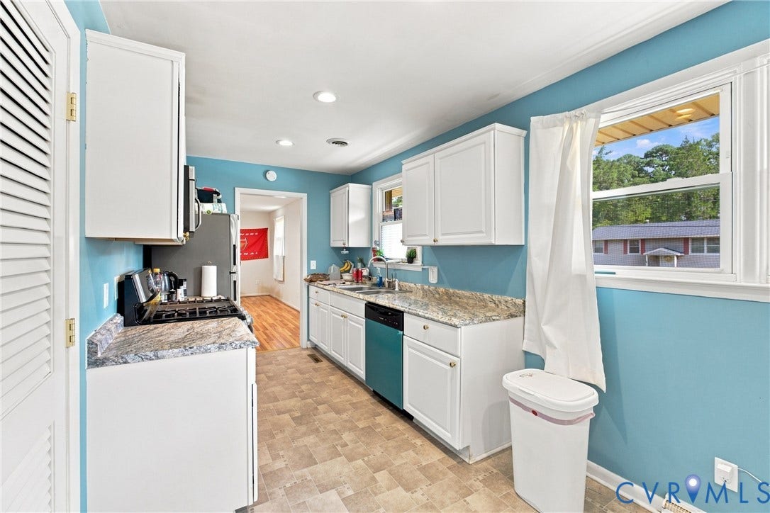 1721 S Halcun Drive, Petersburg, VA 23803 Kitchen featuring white cabinetry, light-toned countertops, recessed lighting, and a window